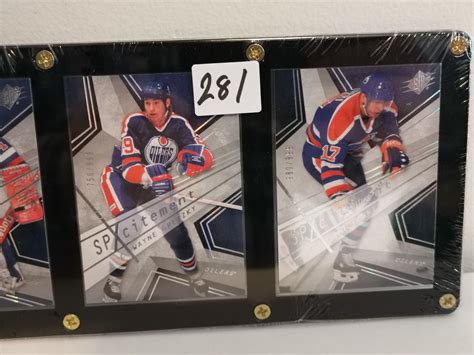 Grant Fuhr, Wayne Gretzky, and Jari Kurri hockey cards - Schmalz Auctions