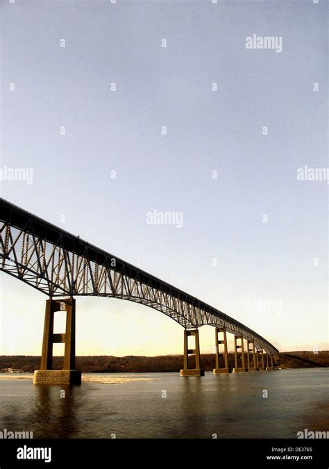 A bridge spanning the Hudson River is captured against a beautiful blue ...