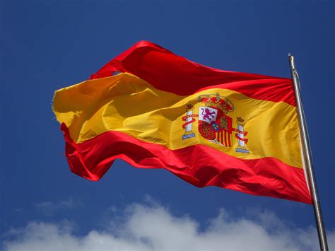 Spanish flag flying on a flagpole | LymeScience