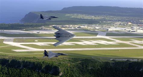 This aerial shot of the U.S. Air Force (USAF) B-2 Spirit stealth bomber and USAF F-15E Strike ...