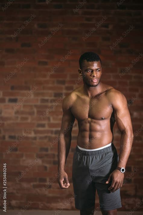 Strong afroamerican athletic man with naked perfect shape muscular body ...