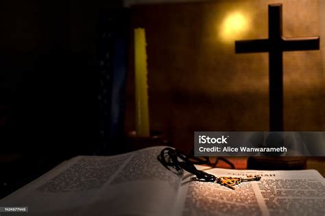 Open Book Holy Bible Twith Wood Cross And Candle For Background And ...