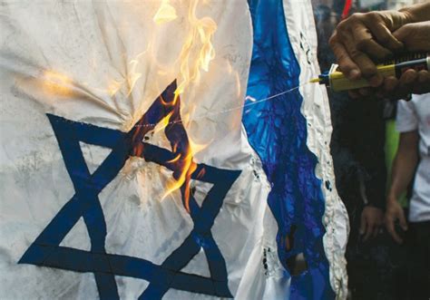 Israeli flag burned at Kiev Holocaust memorial on Yom Hashoah ...