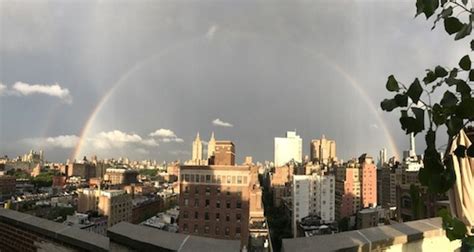 PHOTOS OF THE DAY: A SUN SHOWER AND DOUBLE RAINBOW