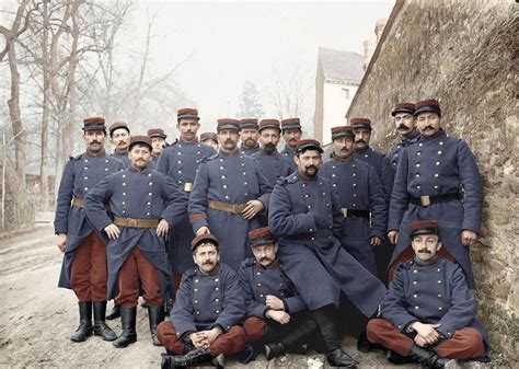 a group of men in uniforms posing for a photo