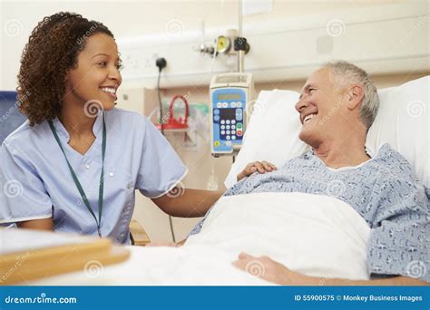 Nurse Sitting by Male Patient S Bed in Hospital Stock Image - Image of race, people: 55900575