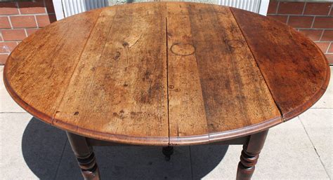 Early 19th Century Round Rustic Drop-Leaf Table at 1stDibs