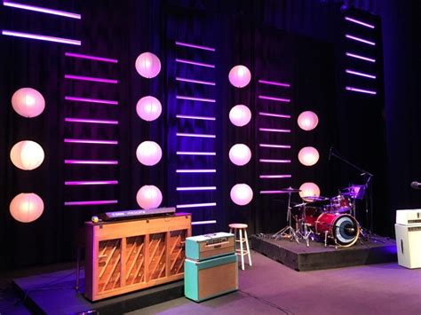 a stage set up with lights and musical instruments