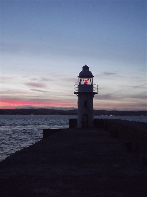 Brixham Lighthouse on the breakwater, Brixham, South Devon, England ...