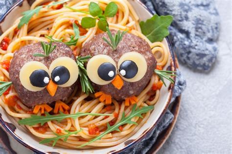 Premium Photo | Spaghetti with funny meatballs for kids