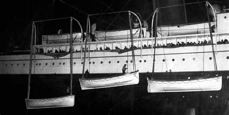 Titanic's lifeboats are lowered into New York harbor by the RMS ...