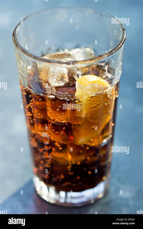 Glass of pepsi with ice on the table Stock Photo - Alamy