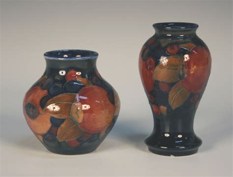 Two Moorcroft pottery Pomegranate pattern small vases, circa 1920, one ...