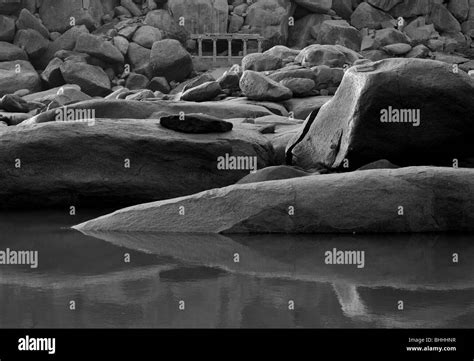 Rock formations by the river Tungabhadra in Hampi, India Stock Photo - Alamy