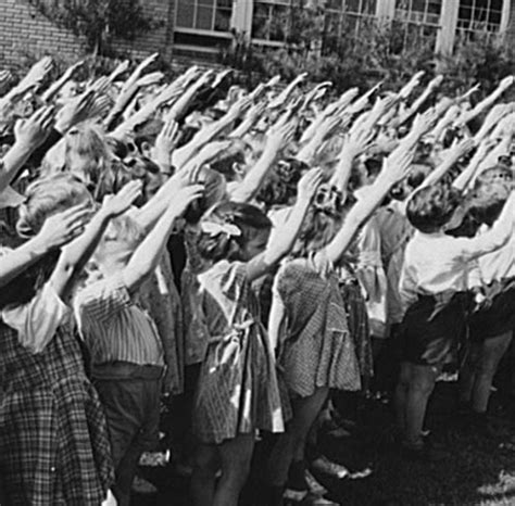 1942 American school kids performing the Bellamy Salute months before Congress changed pledge of ...