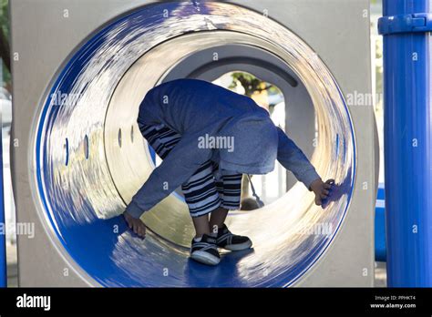 Tunnel slide playground hi-res stock photography and images - Alamy