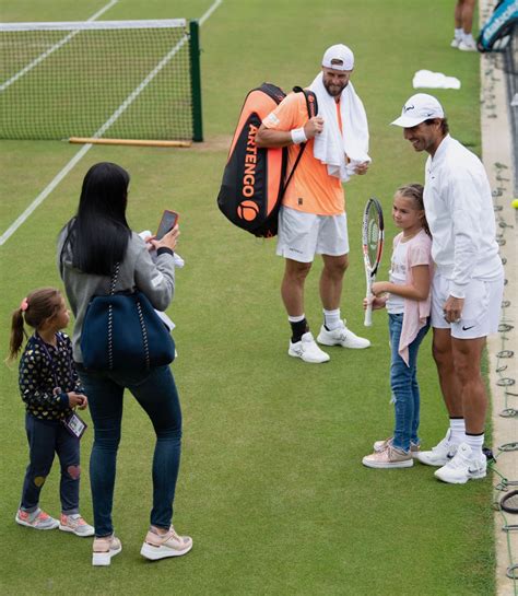 Rafael Nadal poses with a fan on Middle Sunday at Wimbledon photo – Rafael Nadal Fans