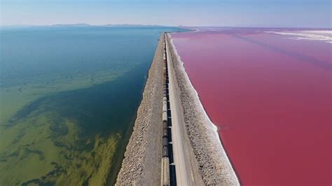 Great Salt Lake Causeway Train over Pink Salt Water - YouTube