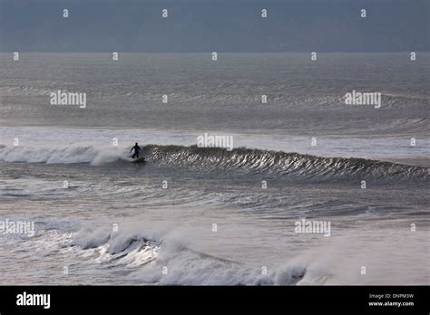 Surfing at Woolacombe Bay in North Devon. This stretch of the UK coastline is very popular with ...