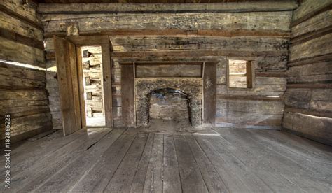 Pioneer Log Cabin Interior. Wooden interior of historic pioneer cabin living room with hardwood ...