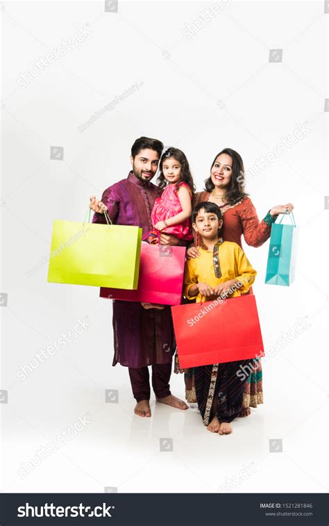 Indian Family 4 Shopping Bags Standing Photos and Images & Pictures | Shutterstock