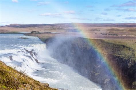 Premium Photo | Rainbow over gullfoss waterfall in canyon