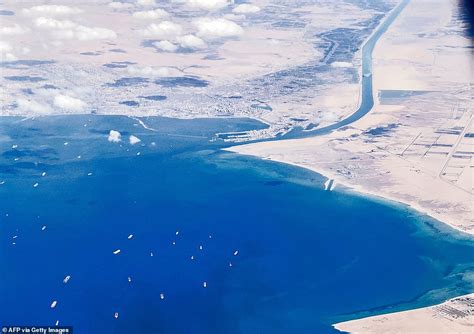 Rescue teams shift 220,000-ton container ship in Suez Canal by nearly ...