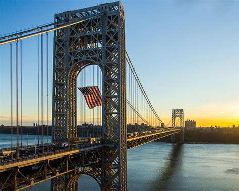 George Washington Bridge Flag At Sunrise Photograph by Rob Quinn