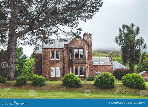 Traditional Irish Cottage Behind the Green Lawn. Stock Image - Image of england, grass: 138460005