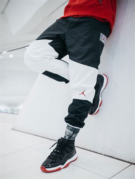 Air Jordan 11 Black Red Bred Hat Clothing Outfit | SneakerFits.com