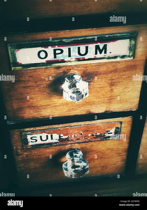 Old chest of draws with a opium label Stock Photo - Alamy