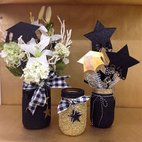 Graduation centerpiece glittered black and gold #masonjar | Graduation party centerpieces ...