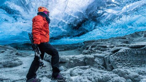 Stunning Video of Brave Hiker Wandering Through Ice Cave Will Give Anyone the Chills ...