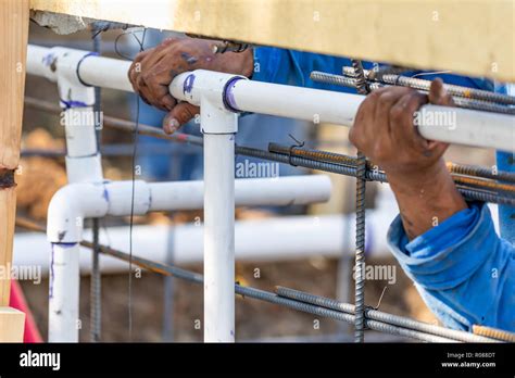 Plumber Installing PVC Pipe at Construction Site Stock Photo - Alamy