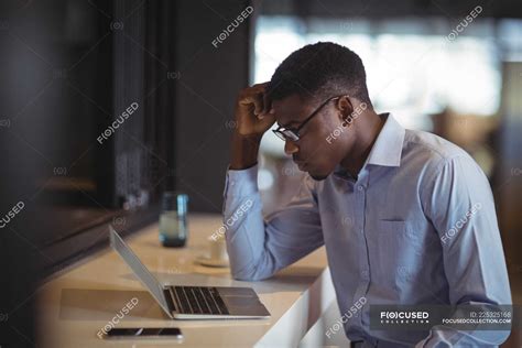 Businessman using laptop in office — profession, male - Stock Photo | #225325168