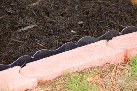 Pave the Way to Easier Mowing With Lawn Edging Pavers | Lawn edging, Mowing strip, Diy lawn