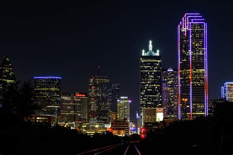 Colorful Dallas Texas skyline at night Photograph by David Ilzhoefer