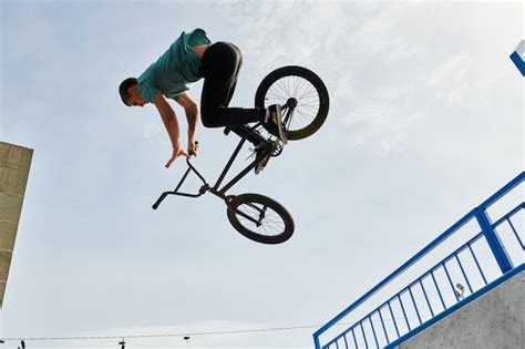 Premium Photo | Young man posing on bmx bike