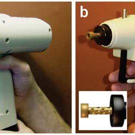 Using the gene gun.The photograph shows the gene gun being used to ...