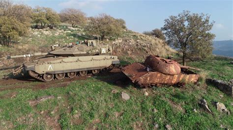 A Merkava MK 4 passes a destroyed Syrian T-55 : r/DestroyedTanks