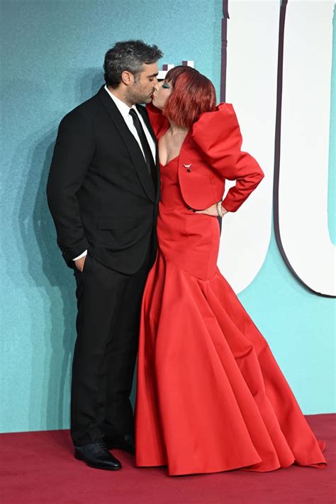 Lady Gaga looks stunning with fiery red hair as fiancé Michael Polansky ...