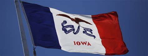 The Iowa state flag flies outside the capitol building in Des Moines.