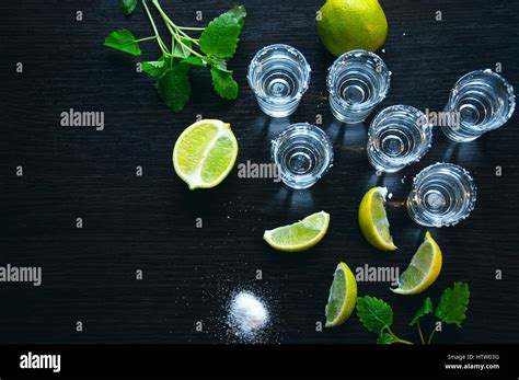 One Silver tequila shots with lime - Traditional Mexican drink Stock Photo - Alamy