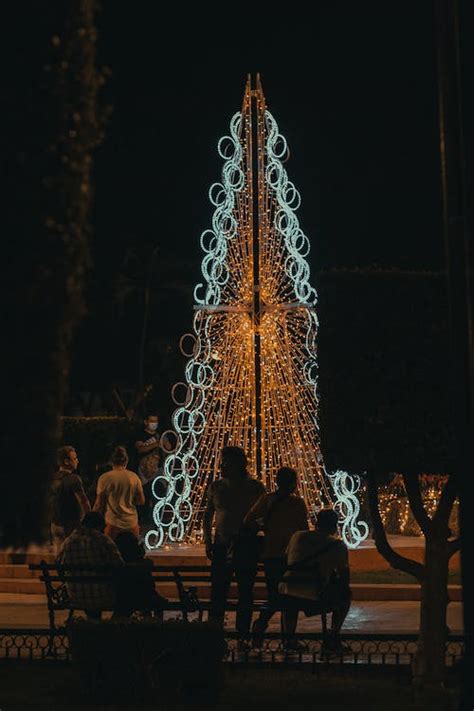 People Gathering near Illuminated Monument at Night · Free Stock Photo