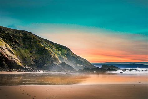 Scenic View of Beach During Dawn · Free Stock Photo