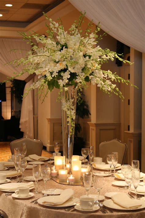 white orchid centerpiece! Wish I could make these myself! | Luxury wedding centerpieces, White ...