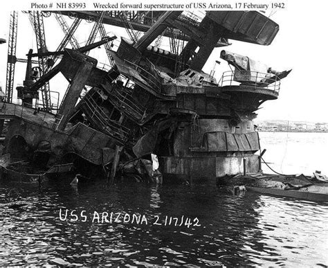 USS Arizona (BB-39) View of the sunken battleship's forward superstructure, showing damage ...