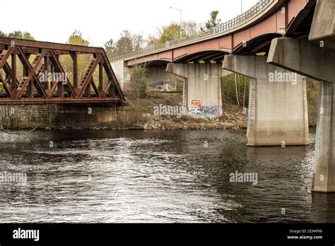 Both of these bridges are located over The Merrimack River in Hooksett, NH. The Old rusty bridge ...