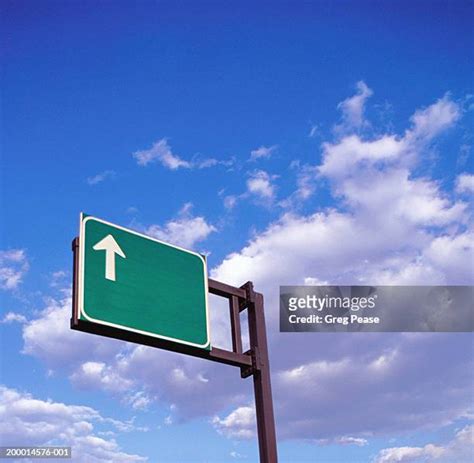 Green Highway Sign With Arrow Photos and Premium High Res Pictures ...