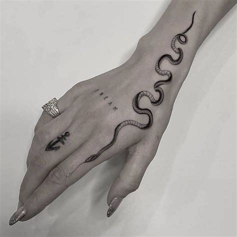 50 Inspiring Bird Tattoo Ideas That Fly High | Arm tattoos snake, Hand ...